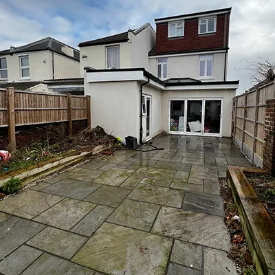 long patio area with white house