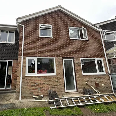 large house with ladder at the front