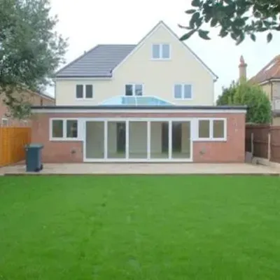 green housing with large house