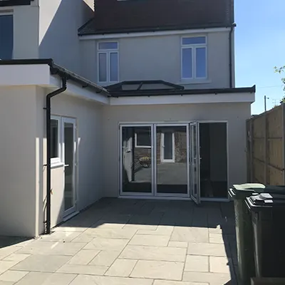 cream house with patio doors 