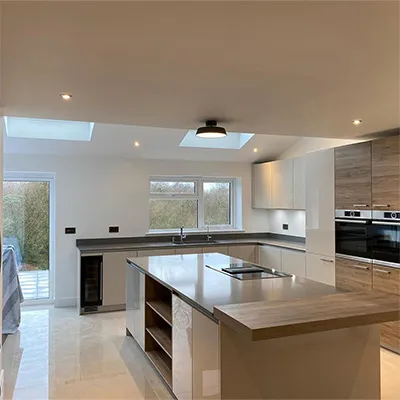 a large kitchen with a center island in the middle of it